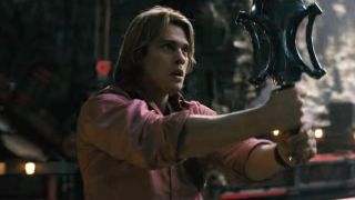 Nicholas Galitzine's Adam holding the Power Sword in Masters of the Universe