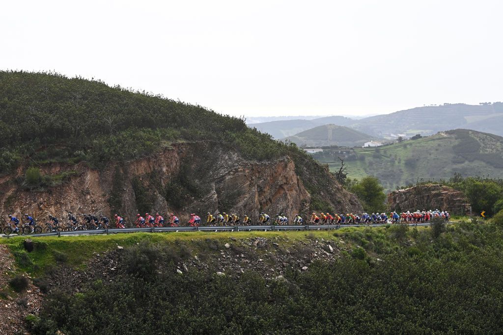 TAVIRA PORTUGAL FEBRUARY 17 Magnus Cort Nielsen of Denmark and Team EF Education Easypost Yellow Leader Jersey and a general view of the peloton passing through Portela da Corcha 497m during the 49th Volta ao Algarve em Bicicleta 2023 Stage 3 a 2031km stage from Faro to Tavira VAlgarve2023 on February 17 2023 in Taviria Portugal Photo by Tim de WaeleGetty Images