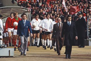 Brian Clough and Bob Paisley lead out the Nottingham Forest and Liverpool teams for the 1978 League Cup final at Wembley.