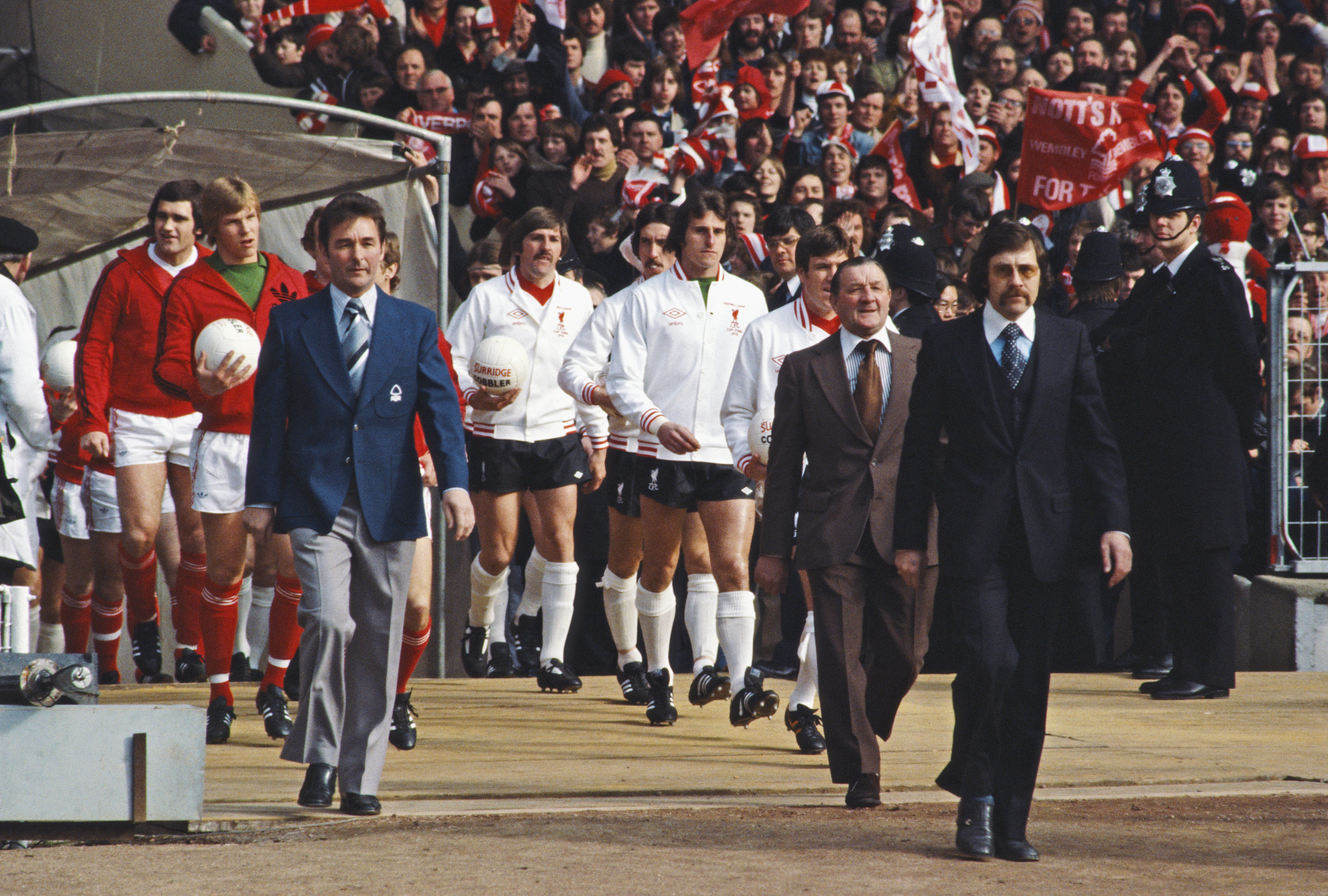 Brian Clough and Bob Paisley lead out the Nottingham Forest and Liverpool teams for the 1978 League Cup final at Wembley.