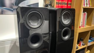 SVS Ultra Evolution Tower floorstanding speakers next to bookshelf