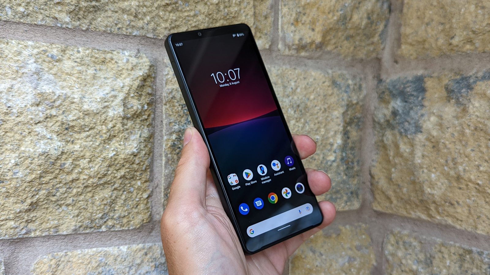 The Sony Xperia 10 IV (front), held in a hand