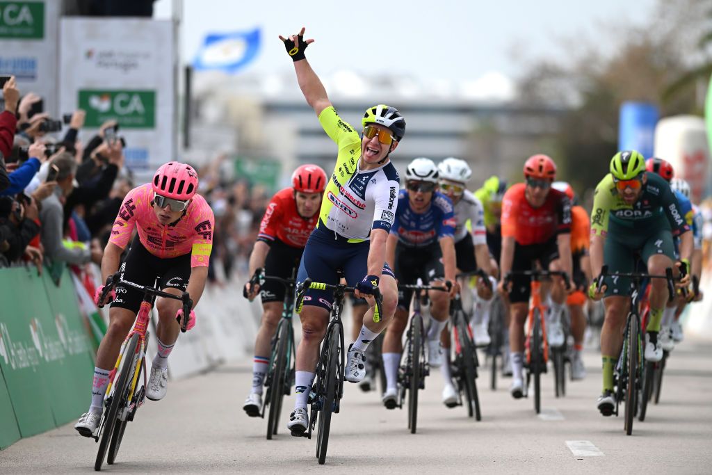 LAGOS PORTUGAL FEBRUARY 14 Gerben Thijssen of Belgium and Team Intermarche Wanty C celebrates at finish line as stage winner ahead of Marijn van den Berg of The Netherlands and Team EF Education EasyPost L during the 50th Volta ao Algarve em Bicicleta 2024 Stage 1 a 2008km stage from Portimao to Lagos on February 14 2024 in Lagos Portugal Photo by Dario BelingheriGetty Images