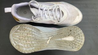 Puma Fuse 2.0 CrossFit shoes from above, one shoe is turned over to show the outsole