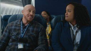 KeiLyn Durrel Jones and Natasha Rothwell look at each other on a plane in How to Die Alone.