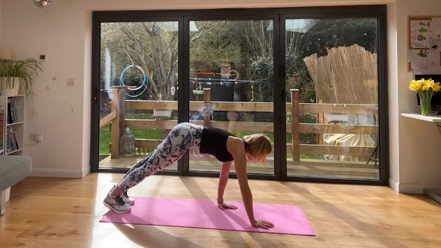 Woman performing an inchworm