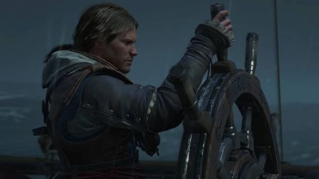 Assassin's Creed Black Flag Resynced screenshot from trailer showing edward kenway standing at the helm of a ship, holding the wheel in the rain