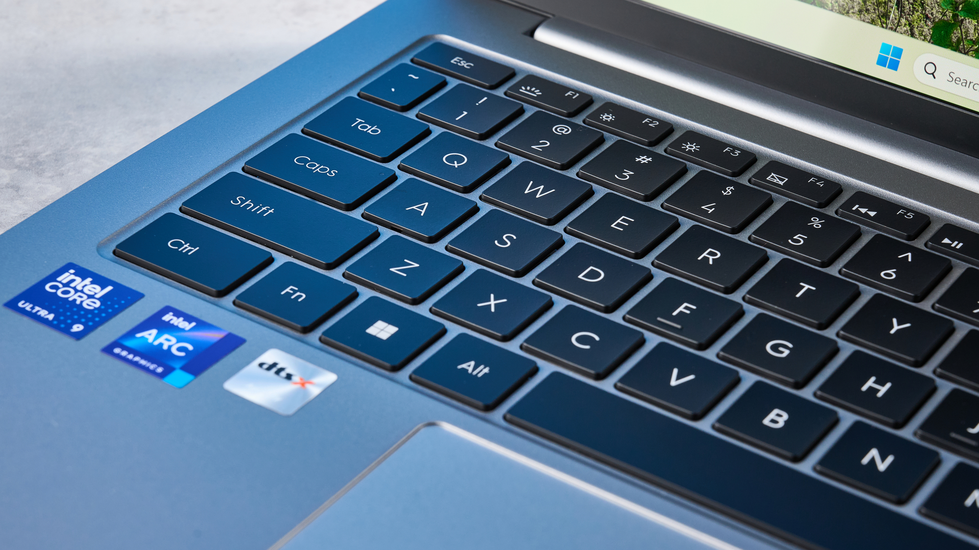 A silver Geekom GeekBook X14 Pro Windows laptop