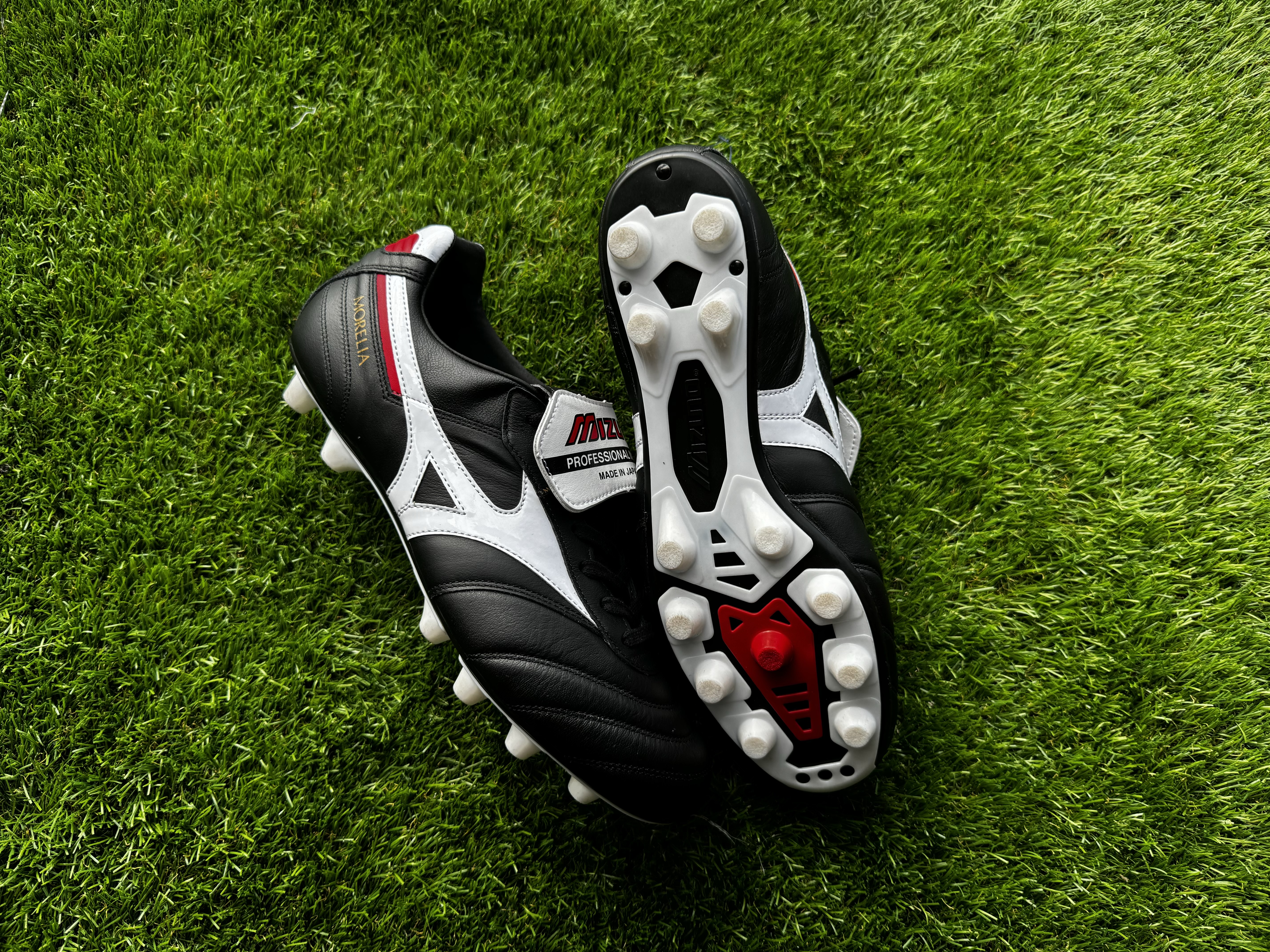 Mizuno Morelia 2 Made in Japan black and white football boots shot on green astro turf