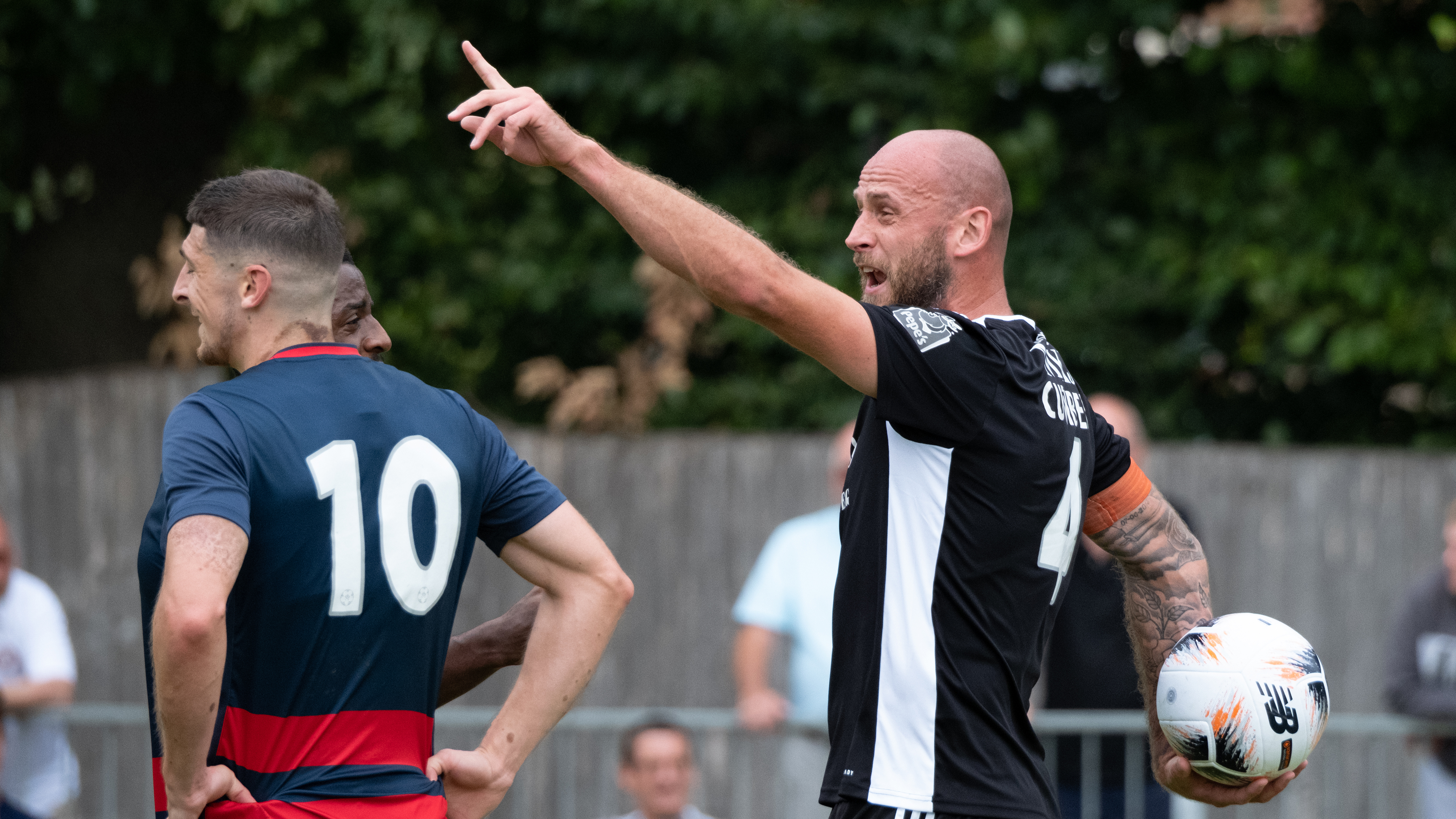 A football player pointing and shouting