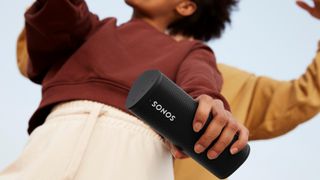 Sonos Roam SL portable speaker being held in the hand