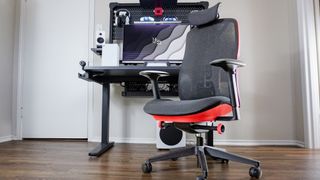 The Herman Miller Vantum Gaming Chair in front of the Corsair Platform: 4 Elevate standing desk