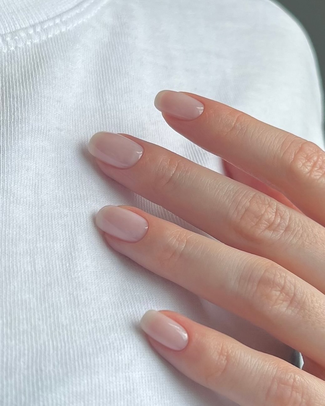 A square-shaped, super sheer, milky white manicure