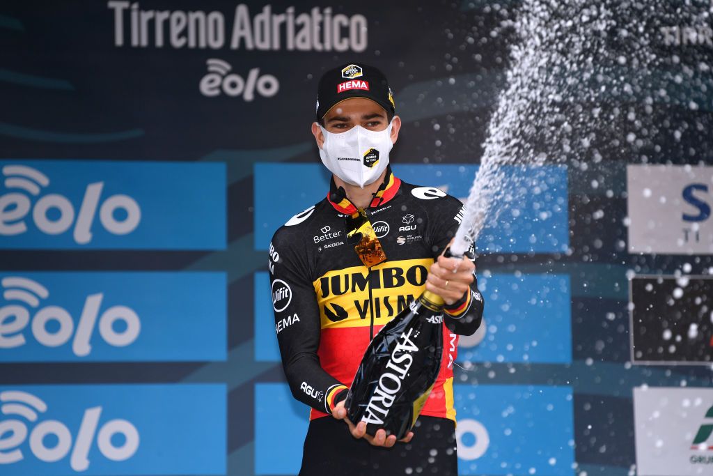 SAN BENEDETTO DEL TRONTO ITALY MARCH 16 Podium Wout Van Aert of Belgium and Team Jumbo Visma Celebration during the 56th TirrenoAdriatico 2021 Stage 7 a 101km Individual Time Trial stage from San Benedetto del Tronto to San Benedetto del Tronto ITT Champagne Mask Covid Safety Measures TirrenoAdriatico on March 16 2021 in San Benedetto del Tronto Italy Photo by Tim de WaeleGetty Images