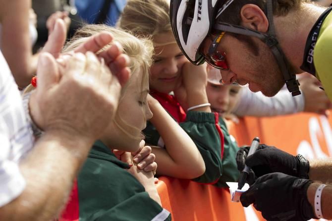 Erik Kleinhans of Team RE:CM signs autographs after winning the Mixed Category