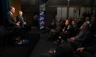 NASA administrator Jim Bridenstine (left) and Douglas Loverro, the new associate administrator for NASA's Human Exploration and Operations Mission Directorate, speak at an agency-wide town hall at NASA Headquarter in Washington, on Dec. 3, 2019.