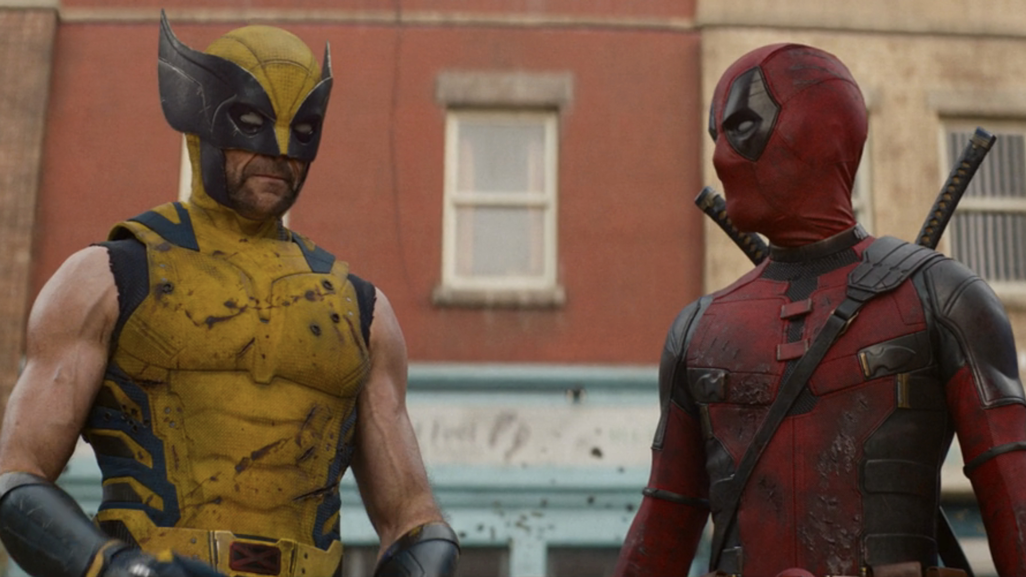 Logan (Hugh Jackman) and Wade Wilson (Ryan Reynolds) look at each other in Deadpool &amp;amp; Wolverine.