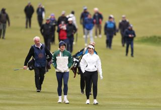 Charley Hull and Georgia Hall walk down the fairway at the Sunningdale Foursomes