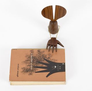 Each sculpture is paired with an original Lustig-designed book