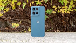 Moto G Play 2026 in front of a bush