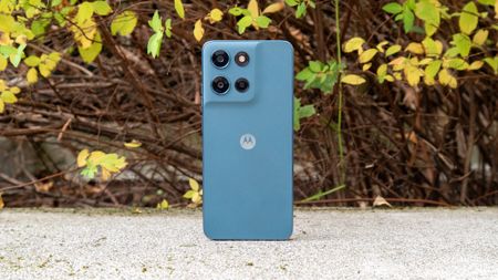 Moto G Play 2026 in front of a bush