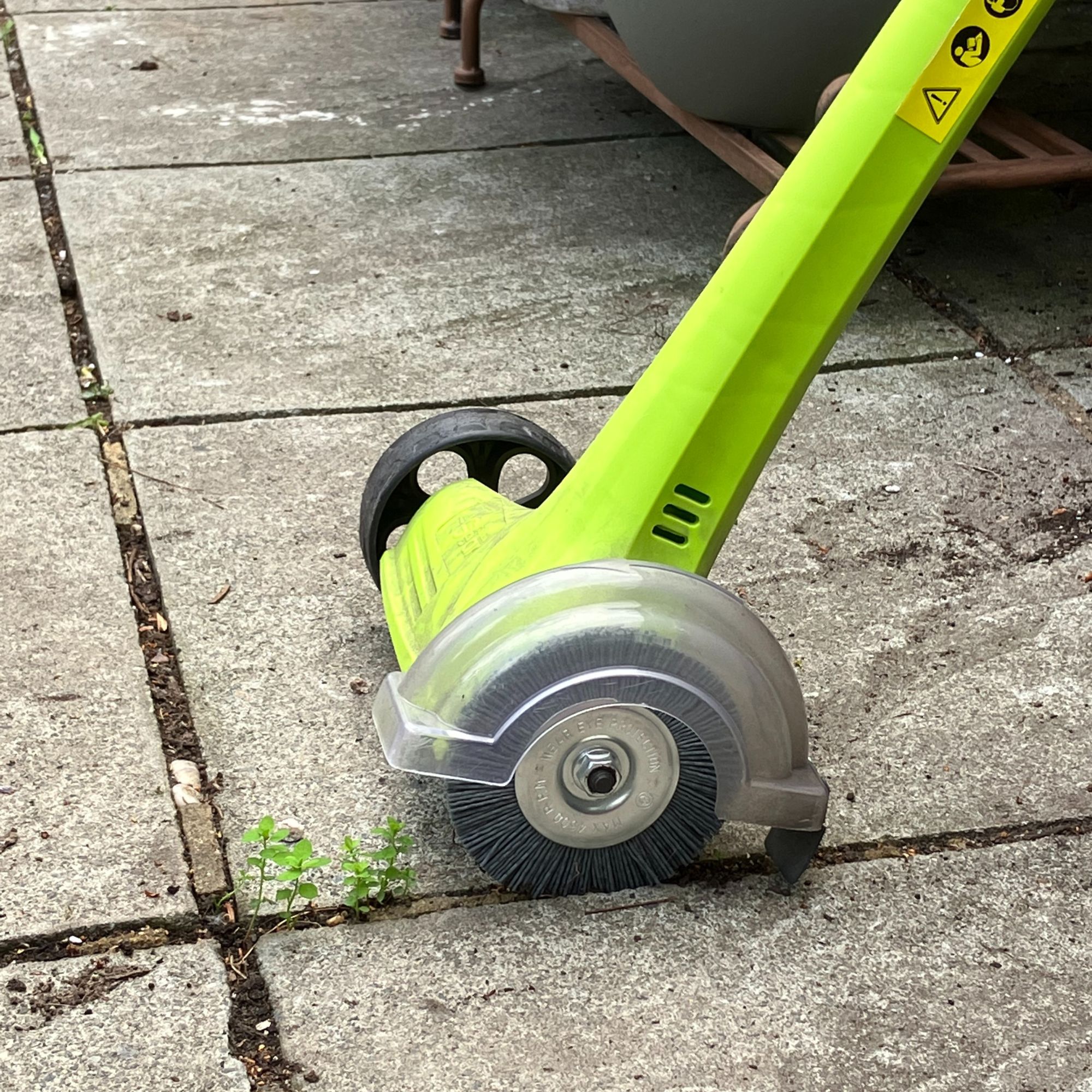 Weed Sweeper tool with paving slabs
