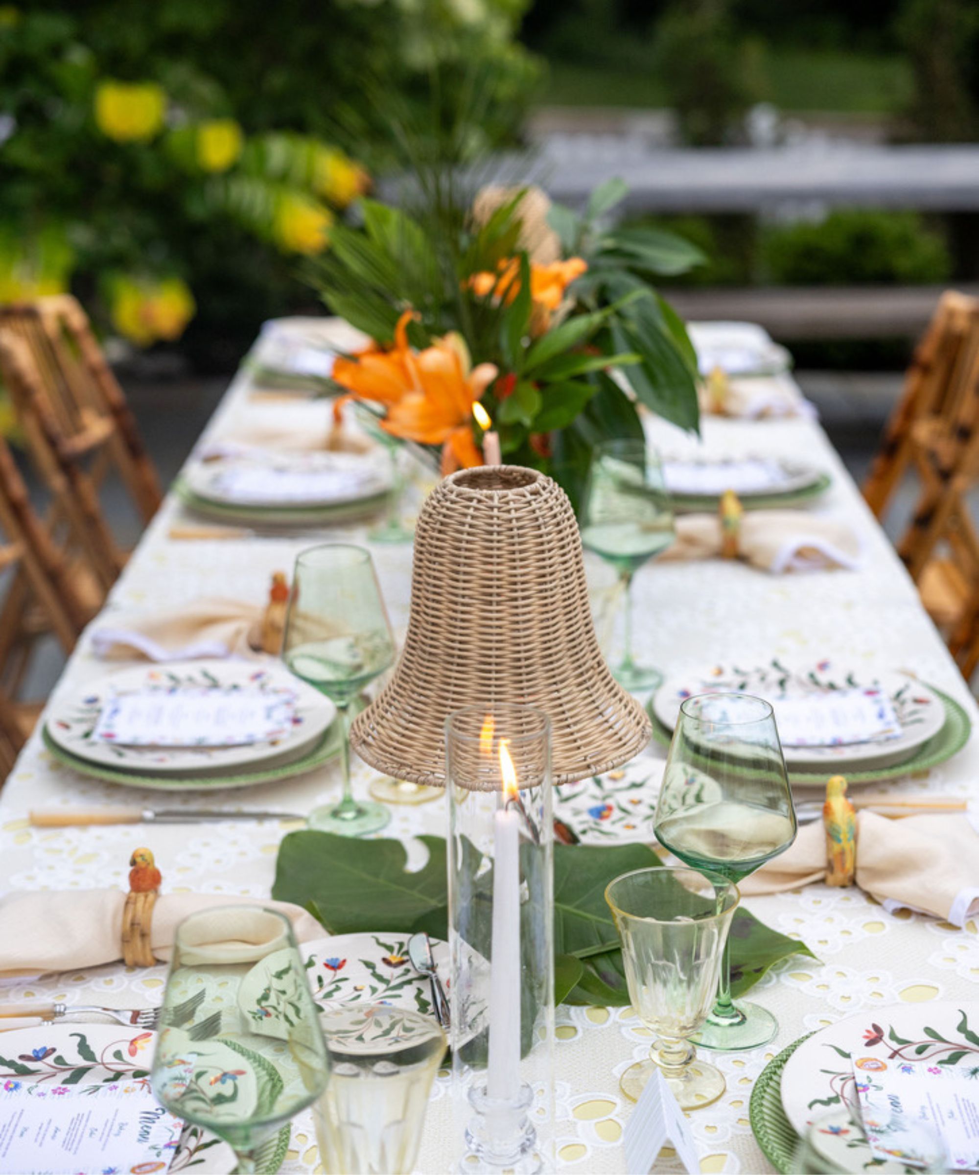 table set with greenery and candles