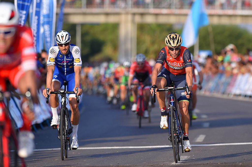 Tom Boonen and Vincenzo Nibali cross the line together