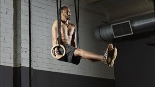 Gym training with gymnastics rings in gym