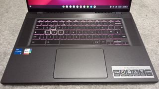 Acer Chromebook 516 GE laptop keyboard on wooden desk