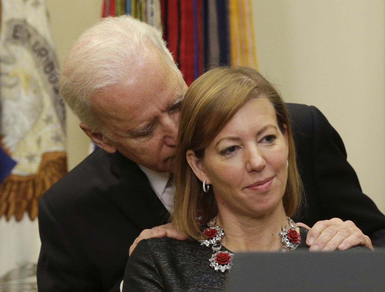 Former Vice President Joe Biden talks to Stephanie Carter as her husband Ash Carter becomes the new Secretary of Defense.