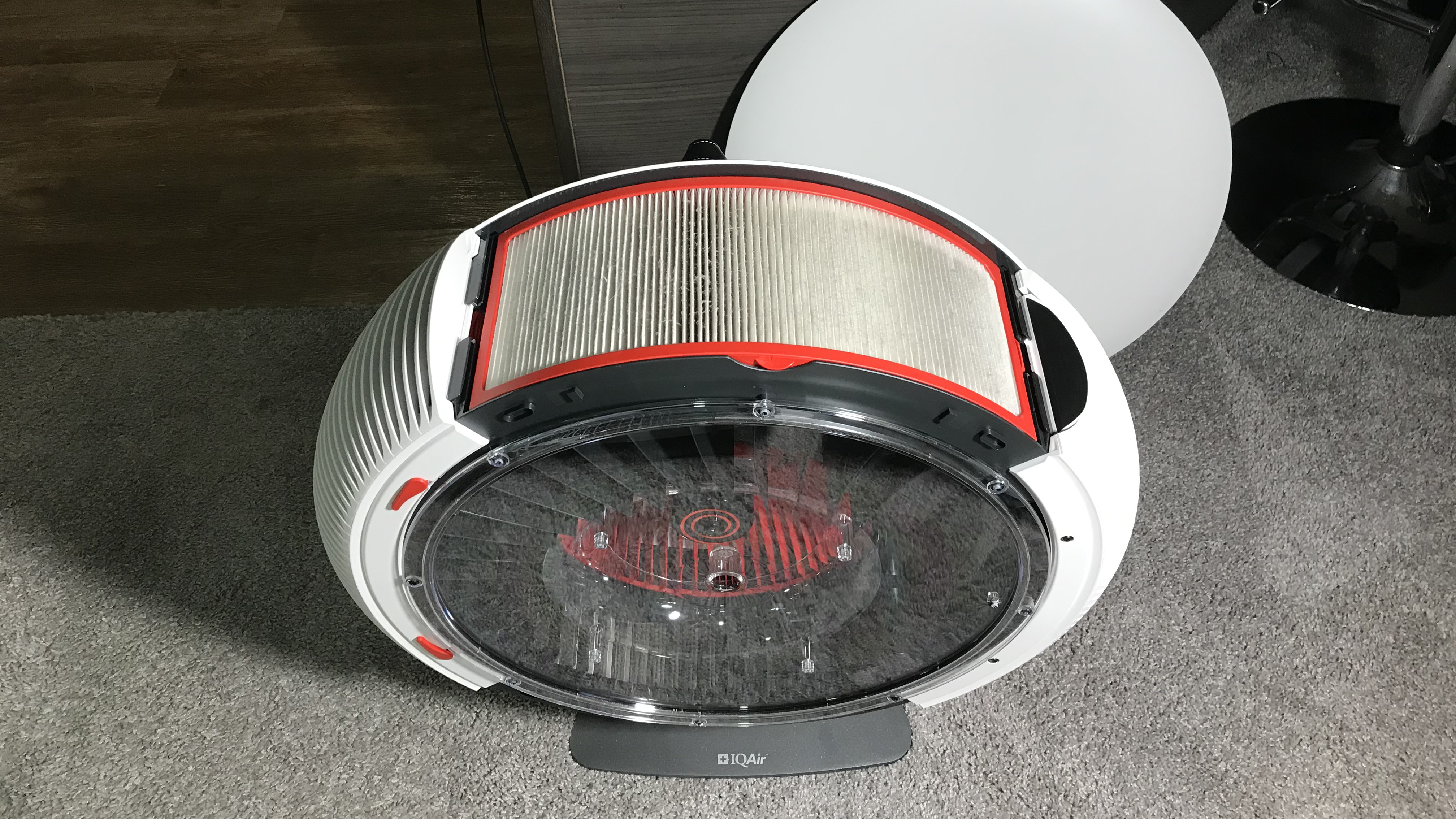 IQAir Atem X air purifier with cover removed and one grille taken off to show a filter