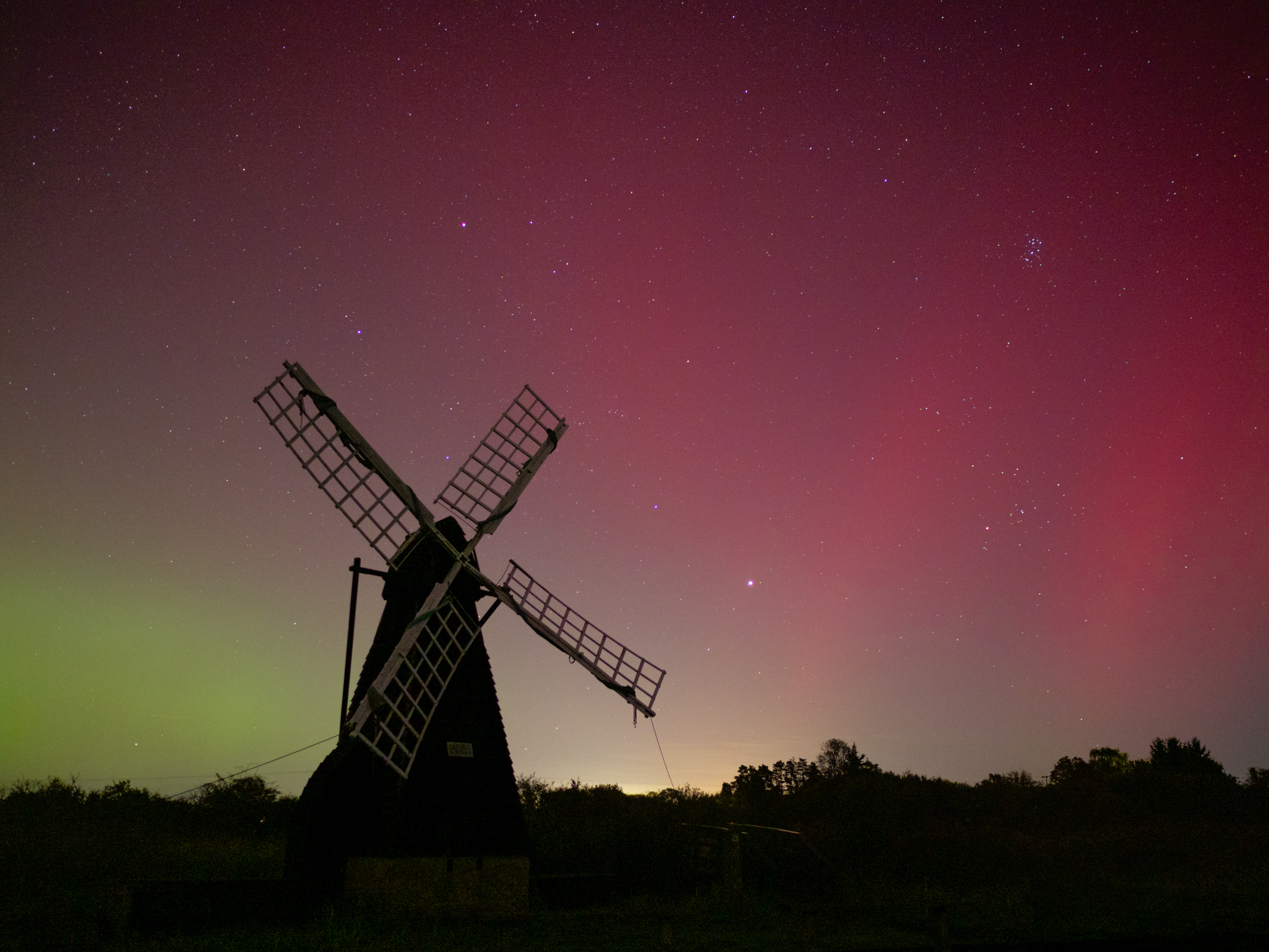 A windpump with the Northern Lights behind shot on a Panasonic Leica Summilux DG 15mm f/1.7 ASPH