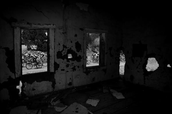 The races passes by an old and well worn adobe house along the route.