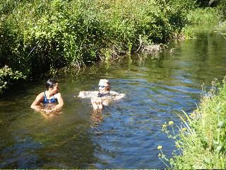 Eight-time European Xterra Champ Renata Bucher and Jenny Smith soaking and pretending to train via swimming.
