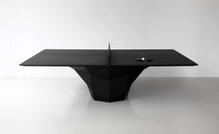 The black aluminium form stands on one leg