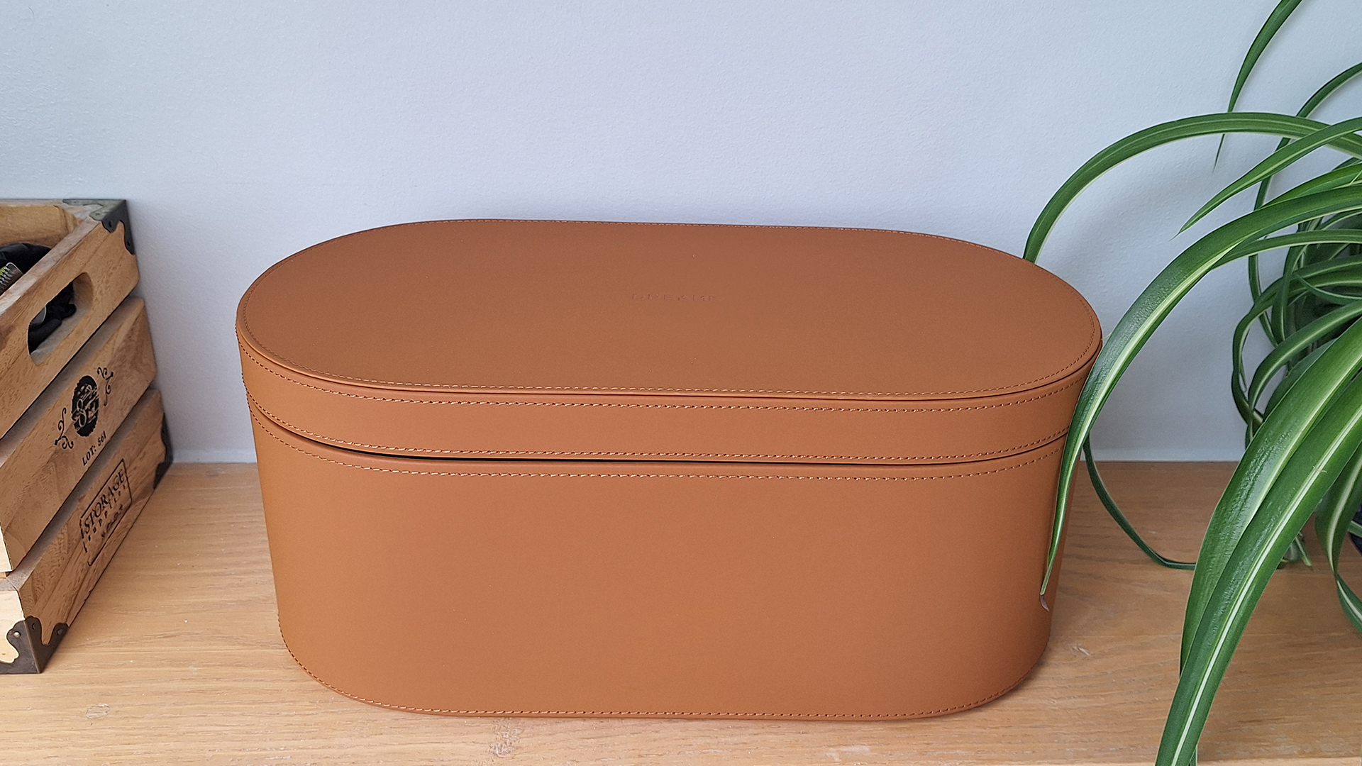 Display case for Dreame AirStyle Pro on shelf in reviewer's bathroom