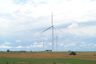 Analysts estimate it would take at least 260,000 turbines, each 300 feet tall, to meet the United States\' electricity needs. These turbines are in King City, Mo.