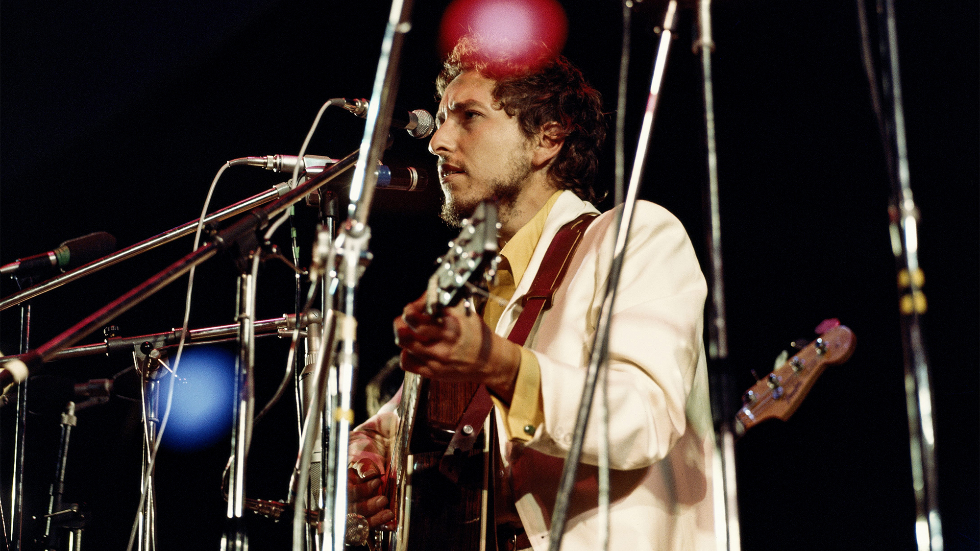 Bob Dylan performs live on stage with the Band at the 1969 Isle of Wight Festival at Woodside Bay, Wootton, on the Isle of Wight, England on 31st August 1969. David Redfern Premium Collection.