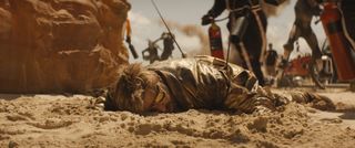 Making the VFX of The Fall Guy; a man lies in sand