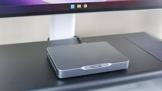 A closeup shot of the Khadas Mind mini PC on top of the Anker 675 USB-C docking station