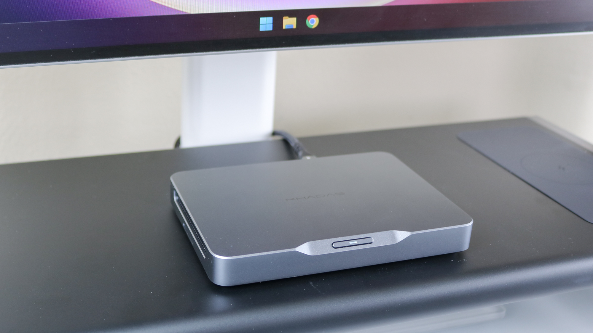 A closeup shot of the Khadas Mind mini PC on top of the Anker 675 USB-C docking station