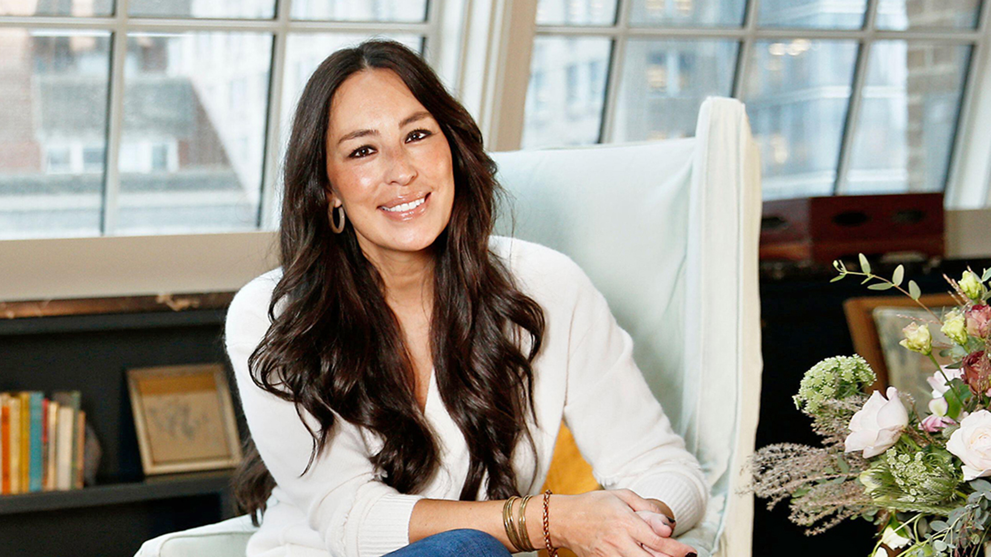 Joanna Gaines sat in white chair