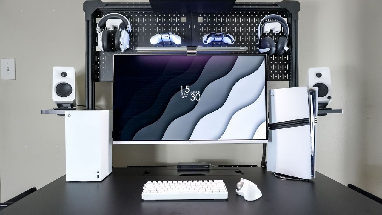 A black-and-white desk setup built around the Corsair Platform:4 Elevate Desk