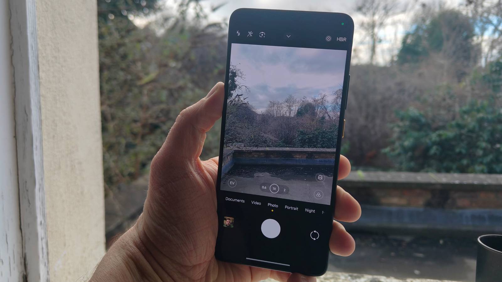 The Xiaomi Poco X7 Pro on a window sill.