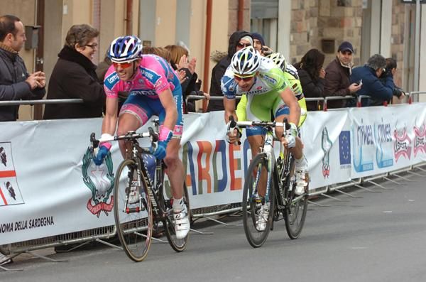 Francesco Gavazzi (Lampre-ISD) attacks and is marked by Peter Sagan and Oscar Gatto (obscured)