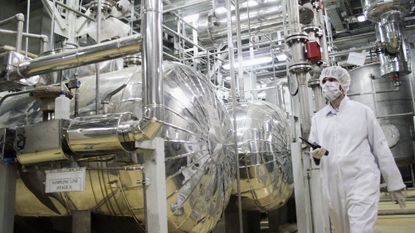 A worker walks inside of an uranium conversion facility just outside the city of Isfahan, Iran