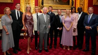 Britain's King Charles III (C) poses with the presenters of the inaugural King's Foundation charity awards at St James' Palace, in central London, on June 11, 2024