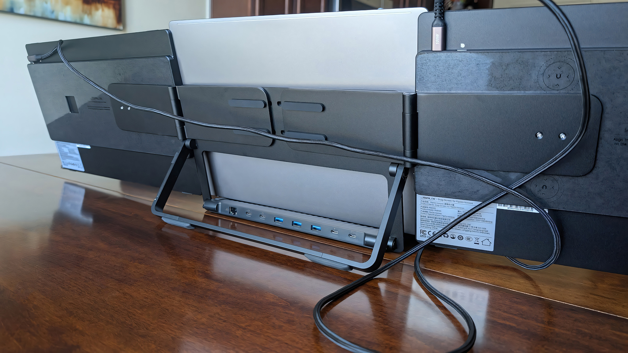 The backside of the JSAUX FlipGo Horizon Pro while it's connected to a laptop. 