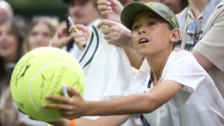 Wimbledon fan asking for a signature.